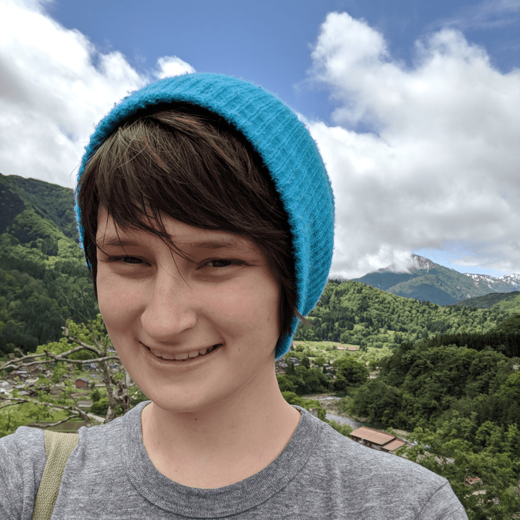 Photo of woman in front of mountains
